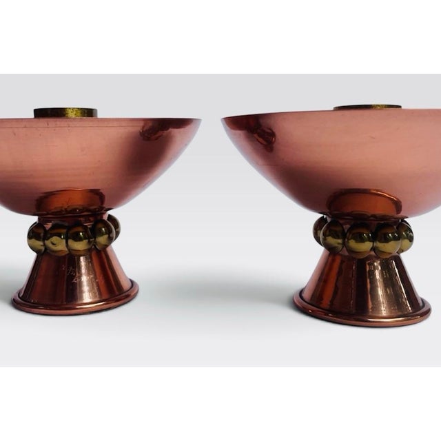 Stunning brass and copper Mid Century candleholders. Cleverly designed with two finishes, copper being the main finish. A...