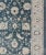 Turkish large Oushak rug with large flower design in teal blue, ice blue/ gray and accent colors of coral and butter....