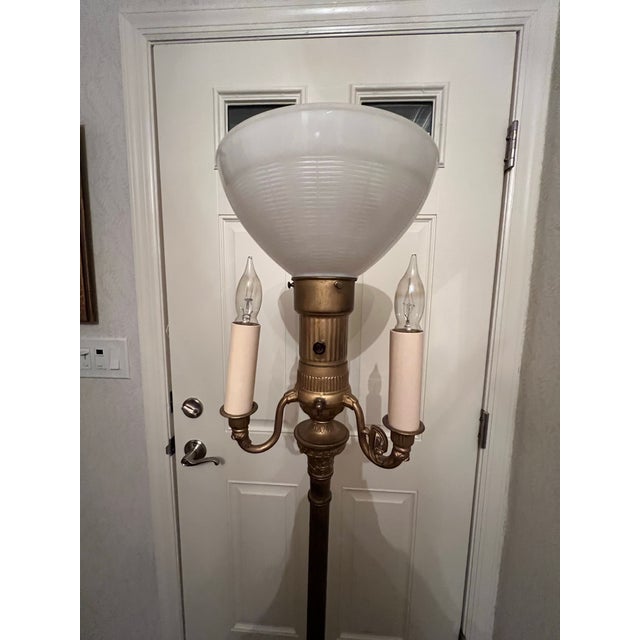 Vintage art deco style metal (brass?) torchière floor lamp with 3 candelabra arms and center frosted glass globe shade....
