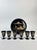 A wonderfully decorative vintage Japanese black lacquerware drinking service comprising six petite stemmed cups, a...