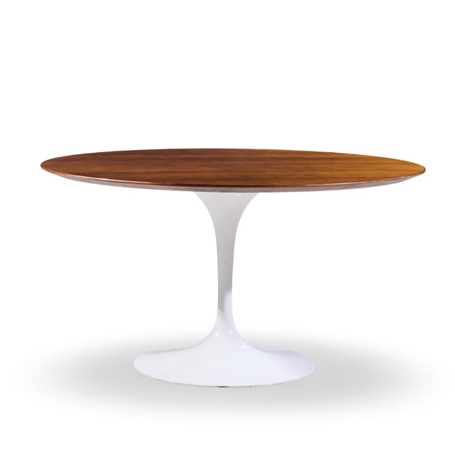 Eero Saarinen for Knoll Mid Century 54 Inch Walnut Tulip Dining Table This dining table measures: 54 wide x 54 deep x...