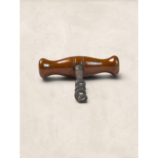 A charming English Victorian corkscrew crafted from turned oak and steel, dating to circa 1890. Featuring a classic...