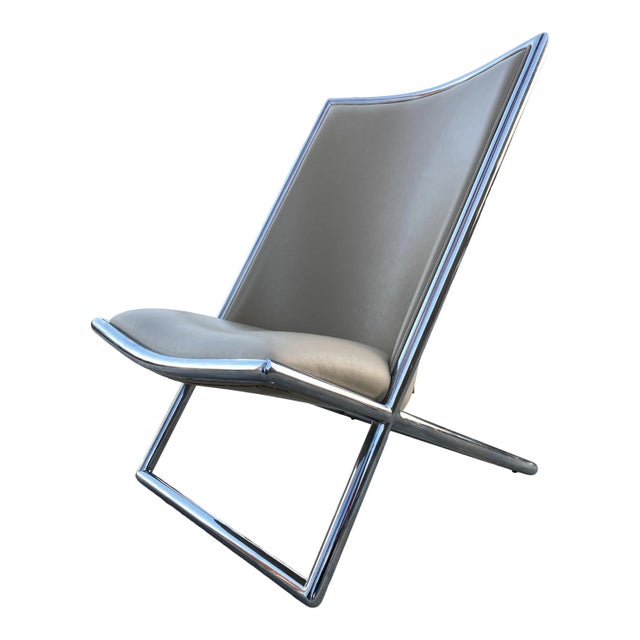 Chrome tubular frame scissor chair by infamous designer Ward Bennett in off-white leather unmarked but well documented,...