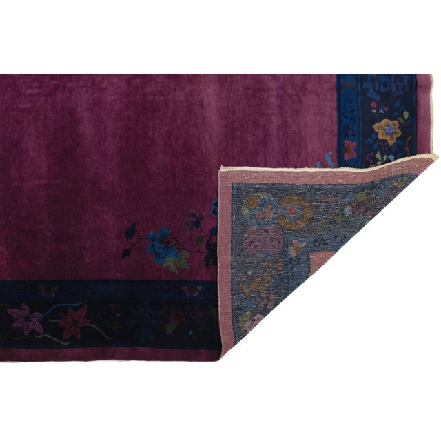 This stunning Antique Chinese Art Deco rug captures the bold elegance of the 1920s with its rich, saturated plum-magenta...