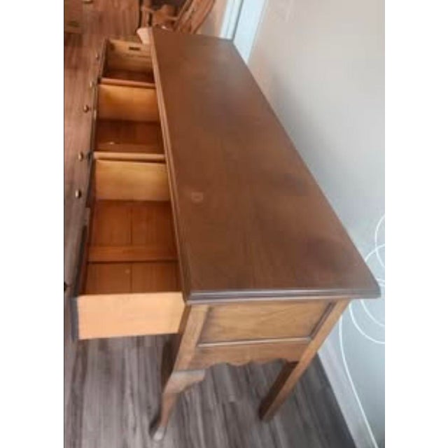 This antique Kittinger sideboard is an antique collector's dream. The sideboard has been incredibly well maintained and is...