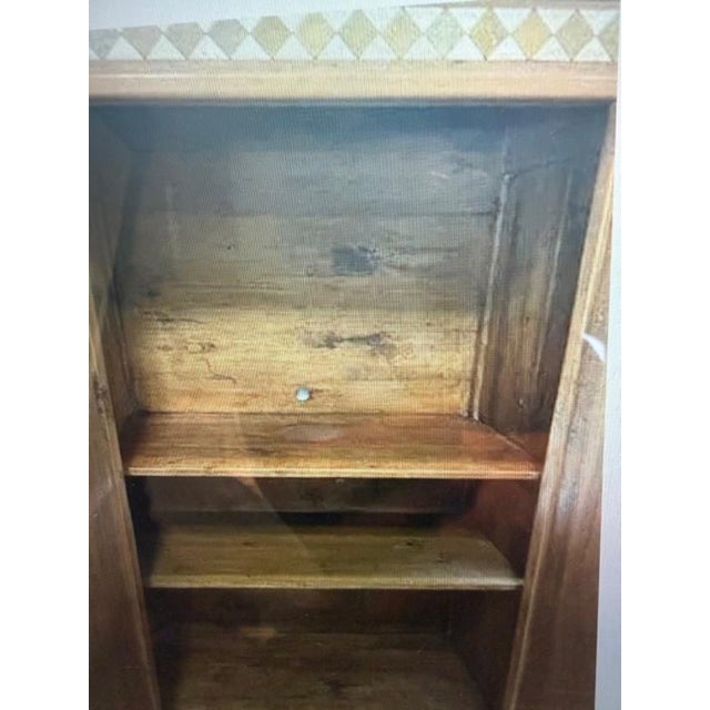Substantial rustic Spanish / Southwestern-style cupboard or cabinet, crafted from solid pine with a warm, honey-toned...