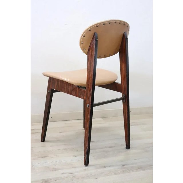 Italian design lovely set of six dining room chairs, 1960s. The chairs are comfortable with a seat in faux leather. The...