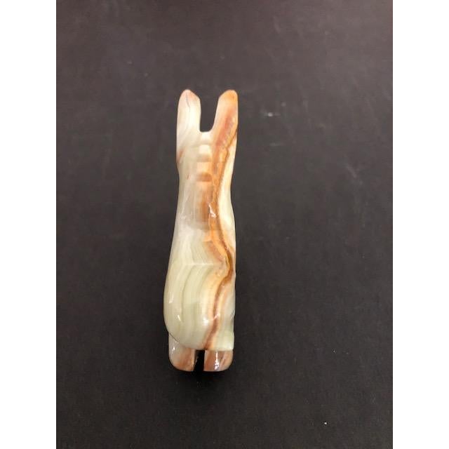 Sweet vintage mid-century figurine of a donkey burro. Made entirely of agate, in shades of white, tan, and brown.