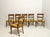 Set of six wooden chairs with open, wraparound backrests. Sabre legs. Padded seat upholstered in damask fabric. 19th...