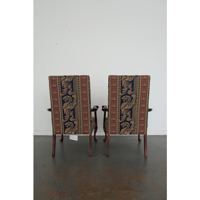 This vintage pair of Parker Southern armchairs reflects classic Chippendale style and dates to the late 20th century....