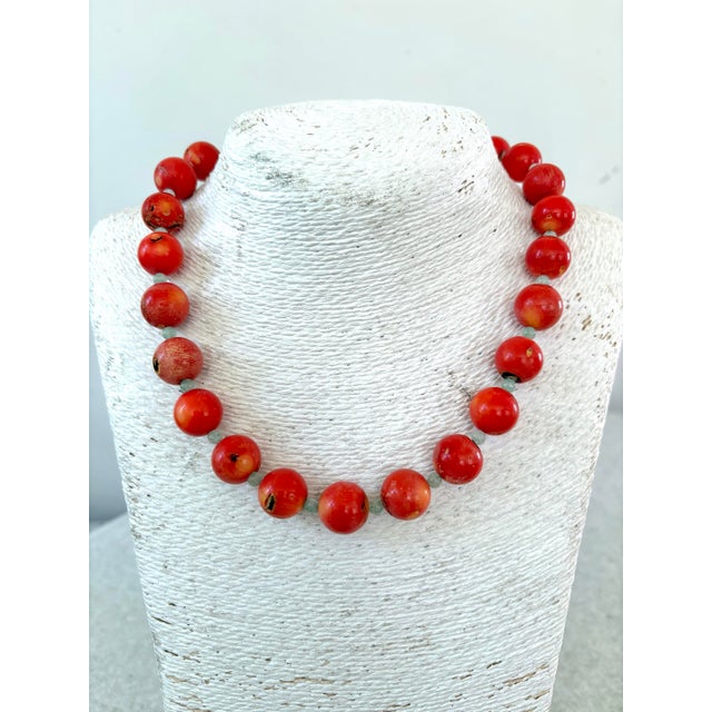 Lovely coral and Jade beaded necklace designed by Matthew Izzo. 13mm coral beads
