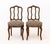 Pair of Louis XV Style Carved Walnut Side Chairs, with upholstered seats and carved grape bunch crestings. 35" H x 17" W x...