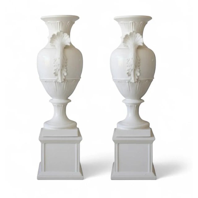 This impressive pair of large-scale Italian Neoclassical urns offers a stately and elegant design element perfect for both...