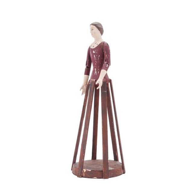 A French folk art / Santos cage doll in carved and painted wood, circa 1800-25. The doll is articulated at the shoulders...