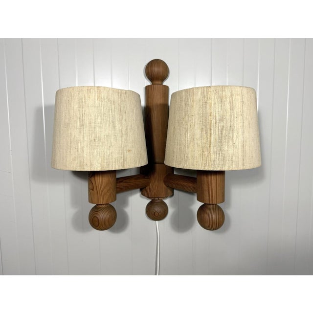 Wall lamp pinus by uno kristiansson for luxus, sweden (marked). pine fixture with 2 arms, white acrylic diffusers covered...