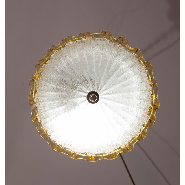 Set of 2 Stunning Yellow and transparent Murano ceiling light. The central plate is surrounded by a wavy yellow stripe...