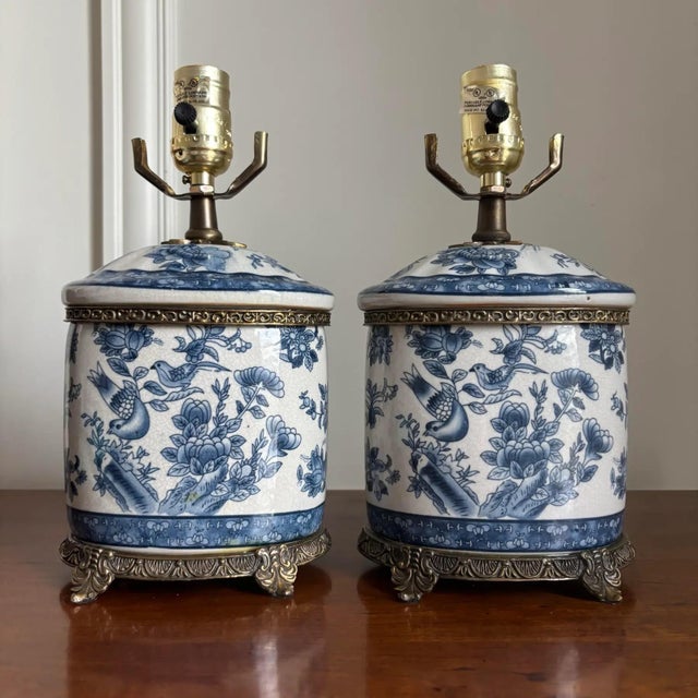 Absolutely stunning pair of vintage blue and white porcelain chinoiserie ginger jar style table lamps. Hand-painted floral...