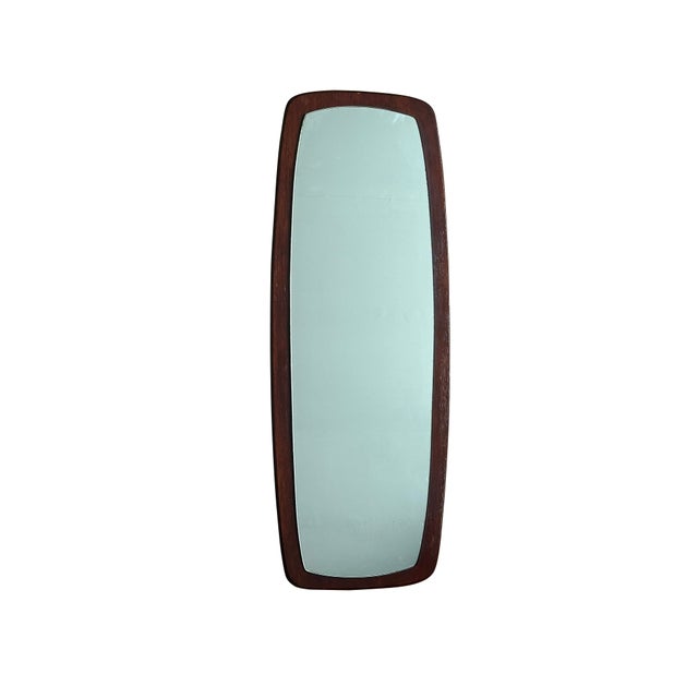This striking wall mirror is crafted from heavy solid teak and features a distinctive raised mirror design, where the...