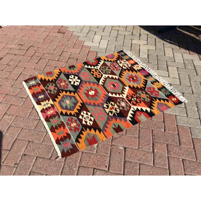 Introducing a stunning Turkish Kilim rug crafted from the finest quality all wool. This one-of-a-kind piece features...
