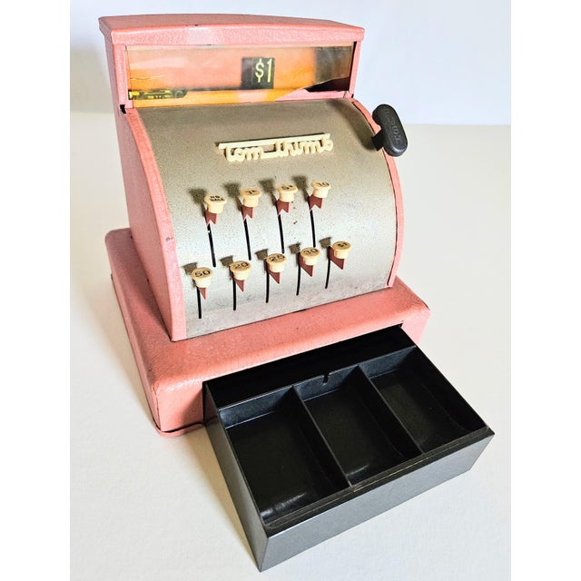 A fun vintage retro Tom Thumb pink and black cash register. Works great, can be used as a novelty jewelry box or spare...