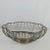 Classic silver wired basket. Can be used for bread, fruit or as an elegant Centerpiece. Wires are secure and the bottom is...