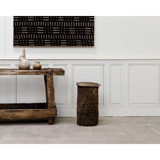 A striking antique beehive made of 19th-century cork, crafted entirely from a hollowed-out tree trunk and retaining all...