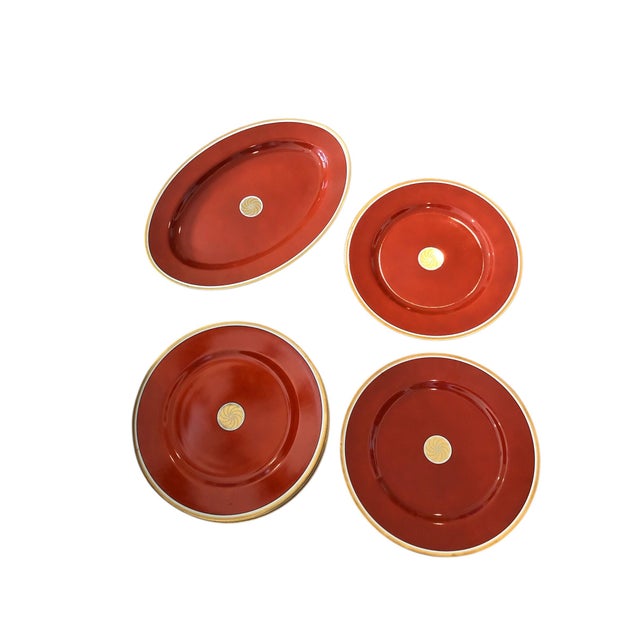 This lovely set of 12 dinner plates and 1 oval platter from the Medaillon d'Or Orange collection of Fitz and Floyd is sure...