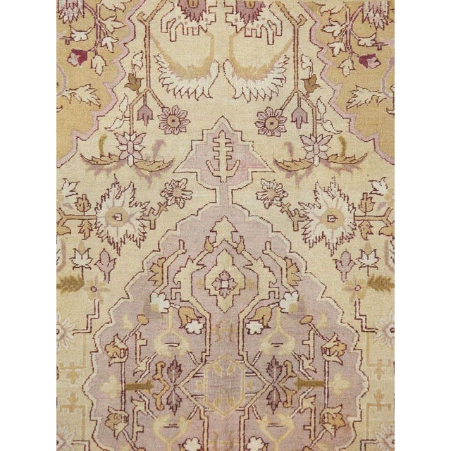 An antique Indian Agra carpet from the first quarter of the 20th century.