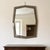 A striking and prestigious double-tiered shaped wall mirror with a smoked glass perimeter frame and a central beveled...