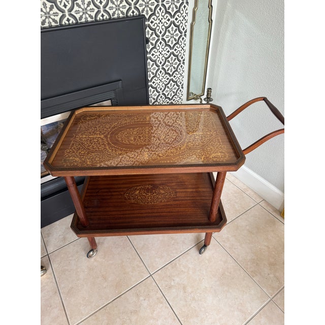 Italian marquetry bar carts became fashionable in the post-war era, often featuring detailed inlaid work work. These were...