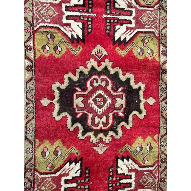 Nice mid century small Turkish rug with beautiful geometrical design and nice colours with red, green, pink, brown,...