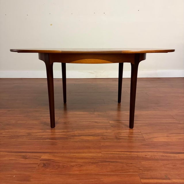 Vintage mid-century teak dining set by Nathan Furniture, made in the U.K. circa 1970's. This is a cleverly designed set...