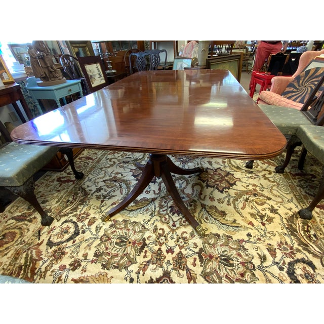 20th century Maitland-Smith regency style Mahogay double pedestal base table. Table has two leaves for extension 20” each,...