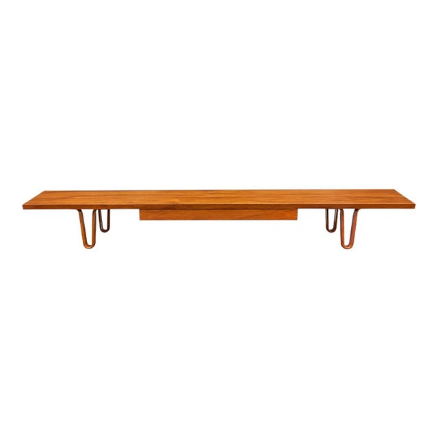 This is a 1950s walnut coffee table designed by Edward Wormley for Dunbar….often called the “Long John”. It is one of his...