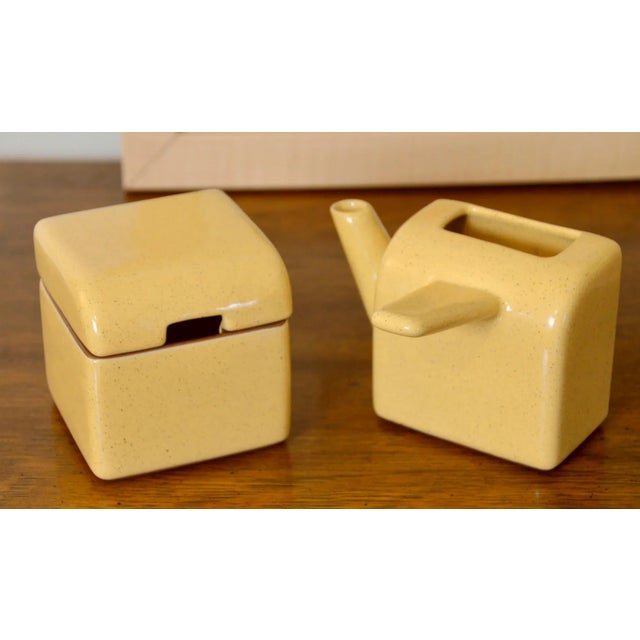 Super fun set of salt and pepper shakers and cream and sugar pots. Each piece is handmade and signed, 2000/2001. Style...