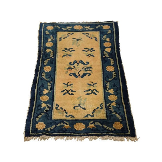 Introducing our Chinese Art Deco Rug, a masterpiece in blue and beige with delicate floral designs. This hand-knotted rug,...
