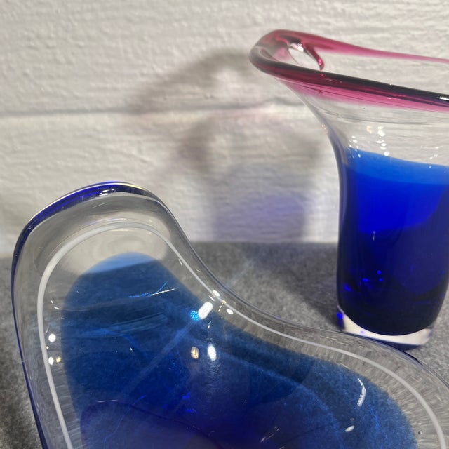 Beautiful free form art glass bowl and vase by Flysfors in vivid colors of blue, white, and magenta. Bowl C.1955 signed by...