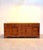 Impressive large teak sideboard , characterized by its warm wood tones, beautiful natural grain and generous proportions....