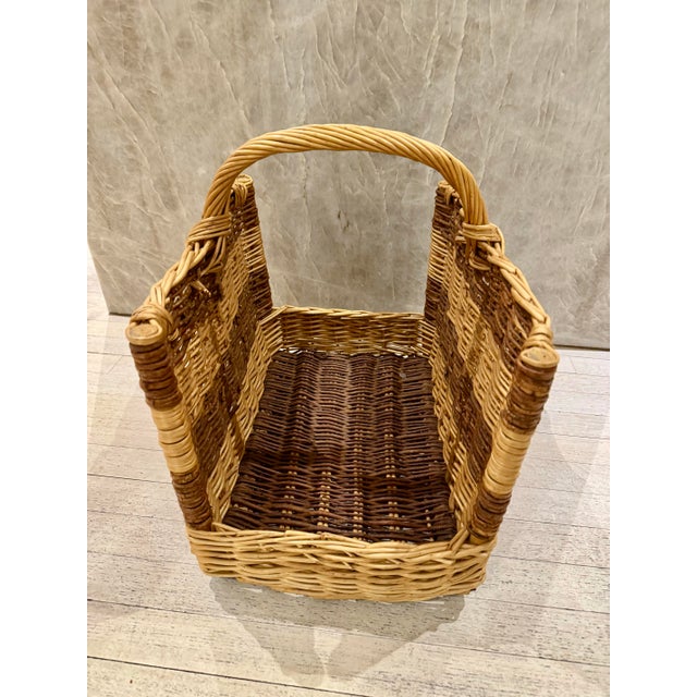 Vintage French log basket. This fireplace accessory is handwoven in two shades of natural wicker, logfire holder with handle.