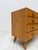 Beautiful vintage Mid-Century chest of drawers crafted in oak during the 1960s. The piece features clean lines, elegant...