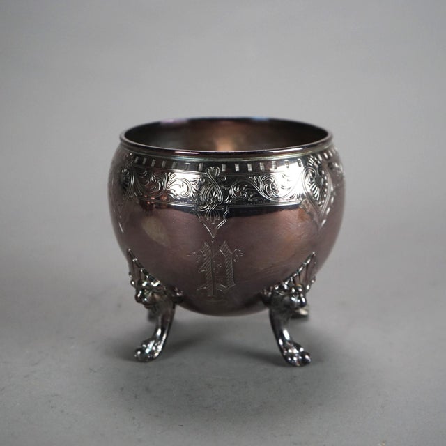 Two Piece Antique Silver Plated Clawfoot Tea Set with Foliate Engraving C1890 Measures - 5"H x 6.25"W x 3.75"D (Pitcher)...