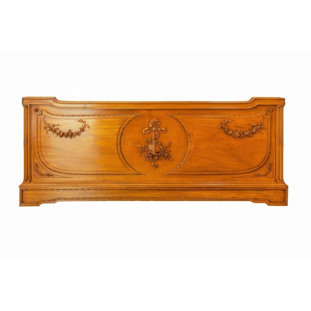French massive walnut head board made circa 1900. Typical of the Louis XVI style. This headboard was previously a...