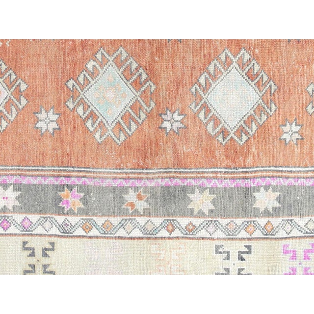 This beautiful vintage Turkish Oushak Rug is hand-knotted with 100% wool on a wool foundation to provide a soft, warm...