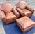 A pair of exquisite French Art Deco Saddle Leather chairs and ottoman from the 20th century. These sumptuous club chairs...