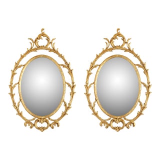 Pair of Oval Giltwood Mirrors With Scroll Motif For Sale