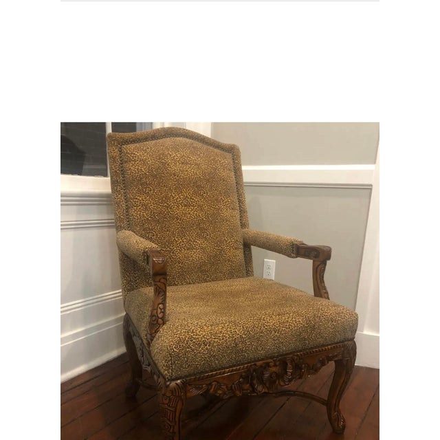 Schnadig occasional chair. Beautifully carved and leopard print upholstered this chair is comfortable and will make a...