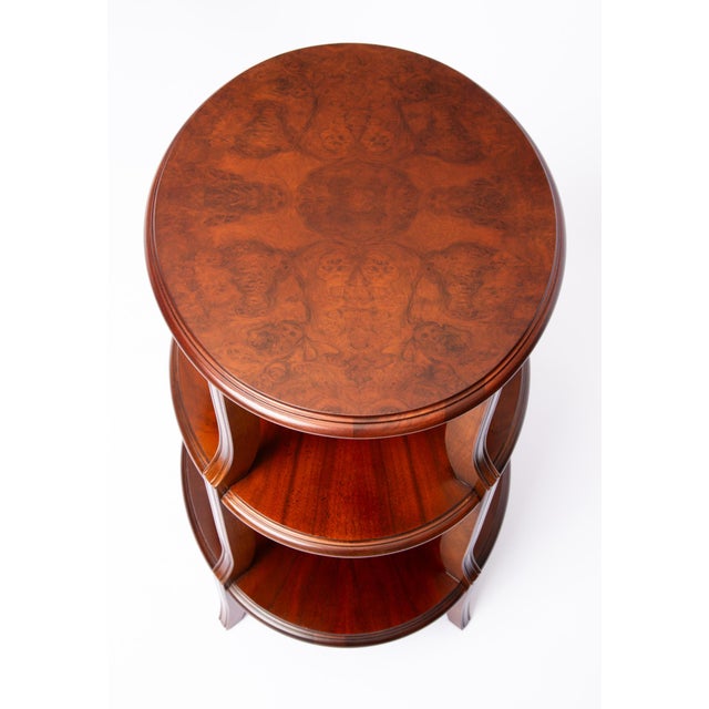 Baker Furniture regency three-tier accent table. A high end piece from Baker's Collector's Edition featuring a striking...