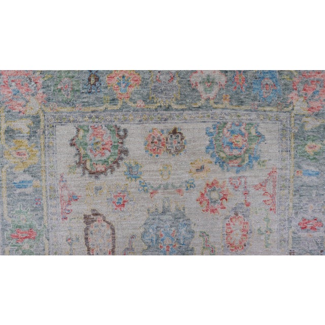 Cream Modern All-Over Floral Oushak With Muted Background and Accent Colors For Sale - Image 8 of 10