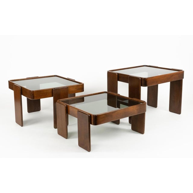 Midcentury beautiful set of three nesting tables in wood and smoked glass attributed to Gianfranco Frattini for Cassina....