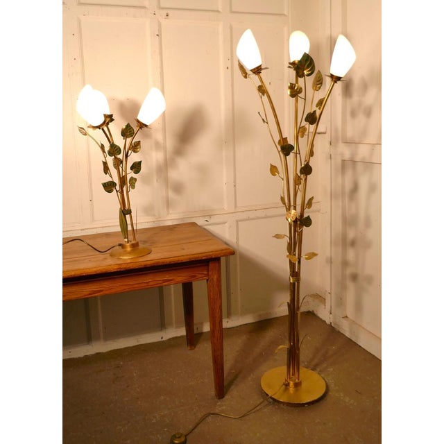 Pair of French Toleware Lamps with Leaves in the Orangery Style, Floor and Table Lamp The lamps have a brassed finish with...